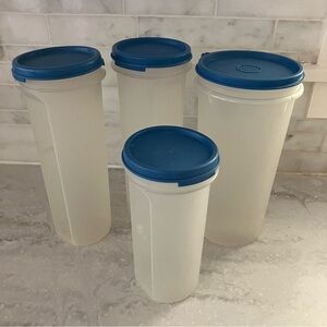 Tupperware set of 4 cylindrical containers with blue lids.  Great condition!